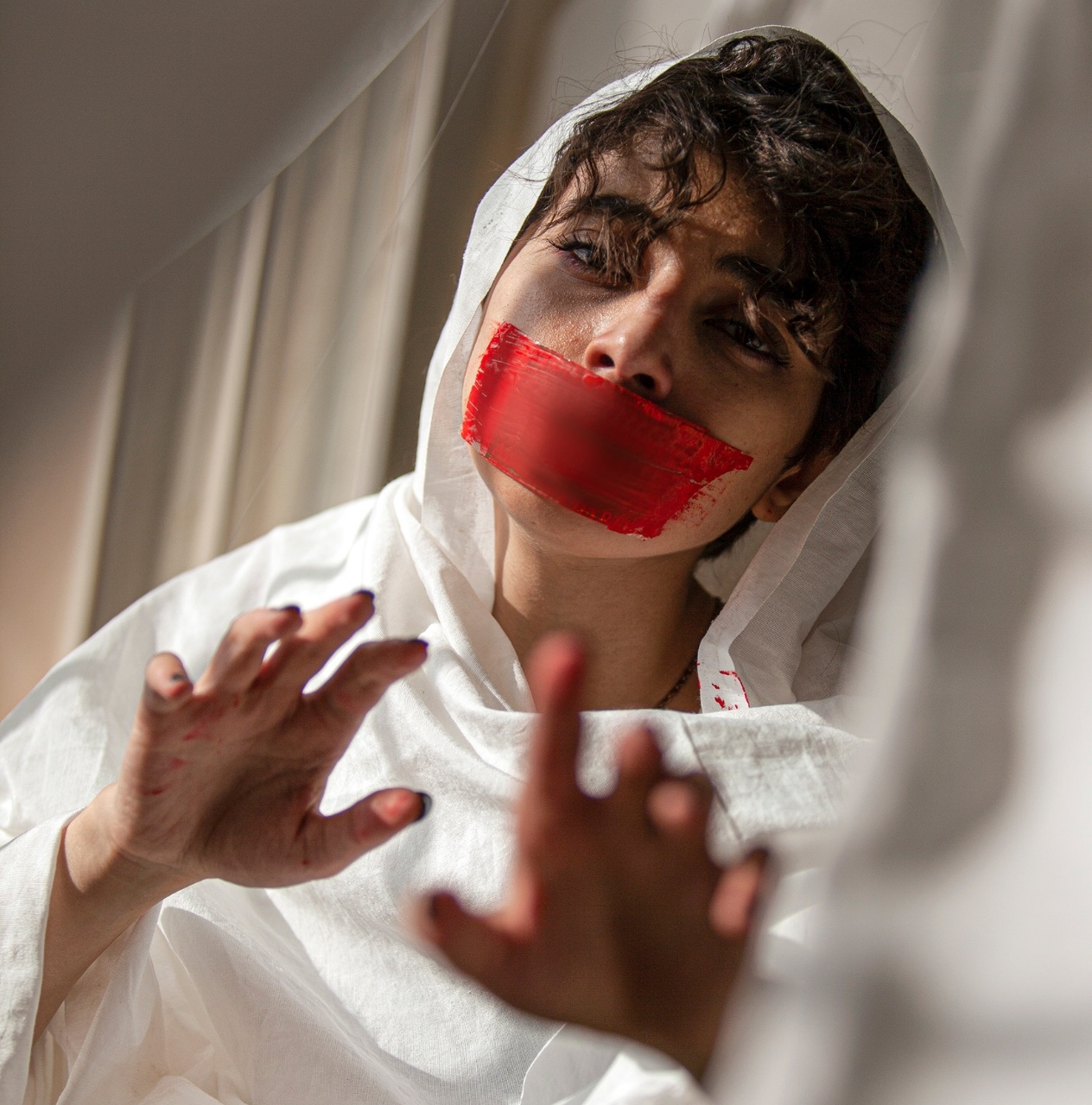 woman with tape on her mouth