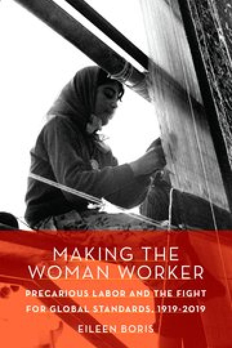 Woman working on weaving loom